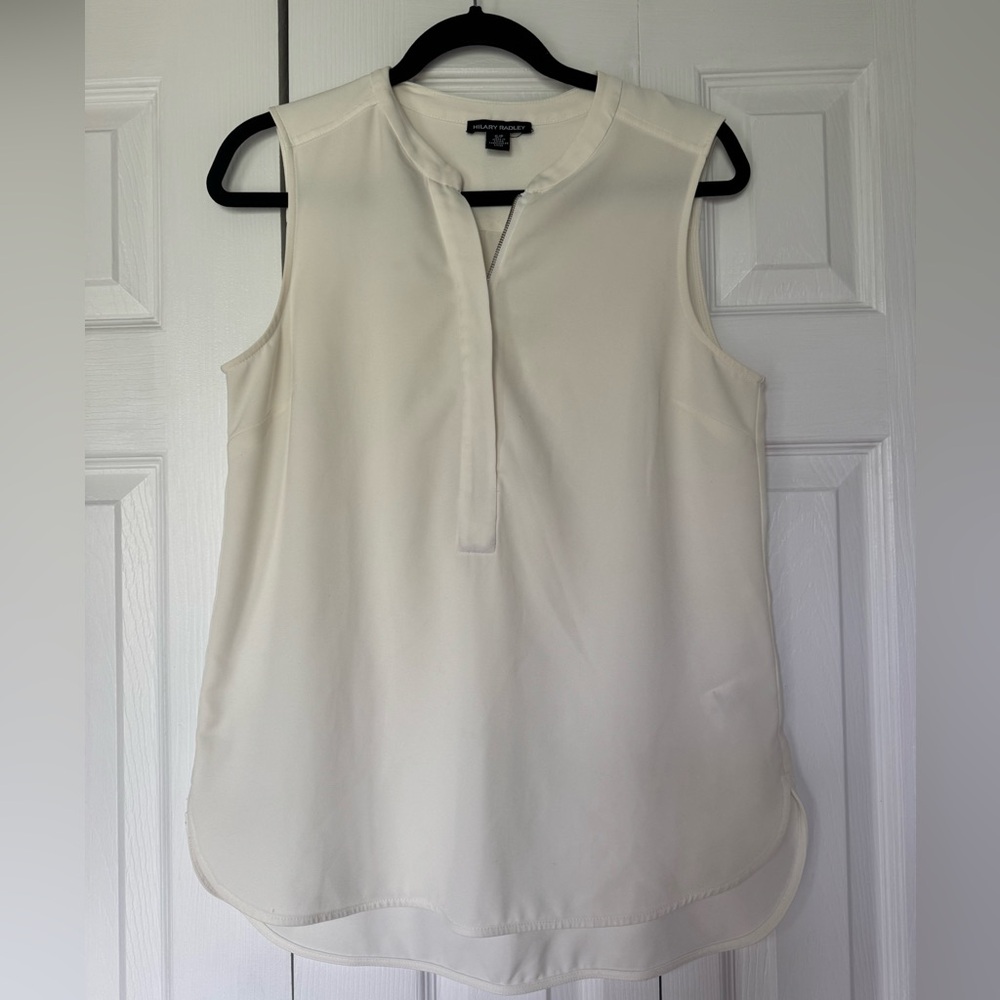 Cream Sleeveless Blouse with a front zipper